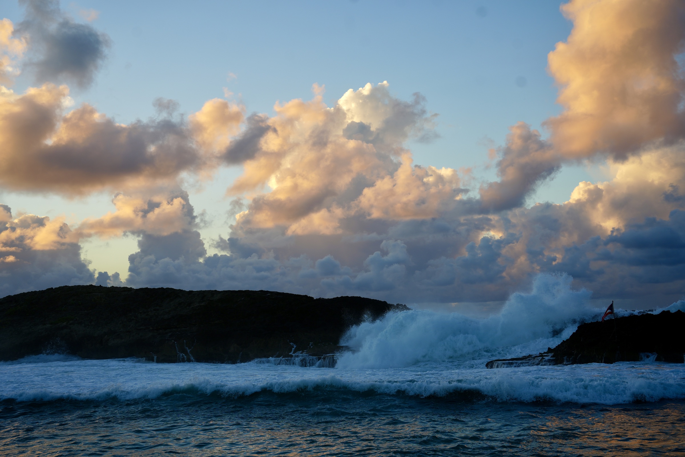 Soft evening light reflected on rolling ocean swells